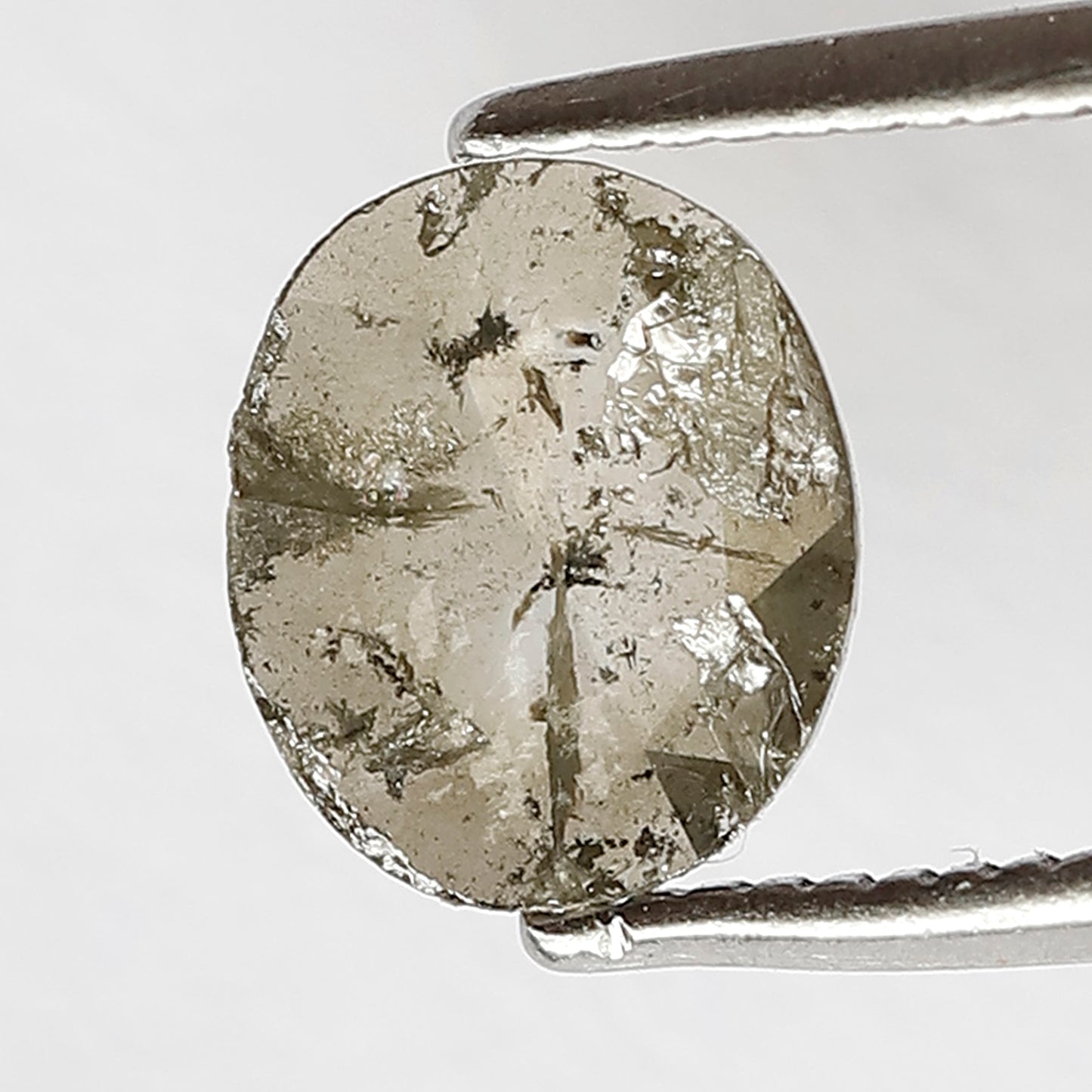 0.72 ct 7 mm salt and pepper diamonds Oval shaped Brownish color diamond