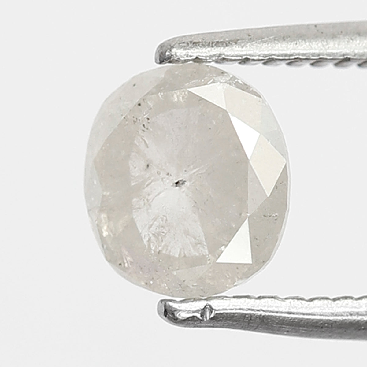 0.76 CT Oval shape Misty White color Natural loose 5.80 mm salt and pepper diamond