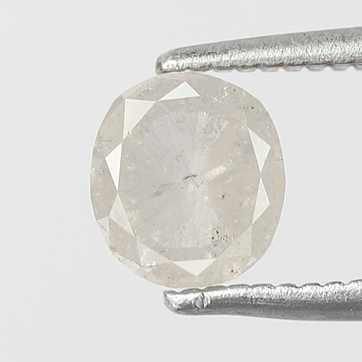 0.76 CT Oval shape Misty White color Natural loose 5.80 mm salt and pepper diamond