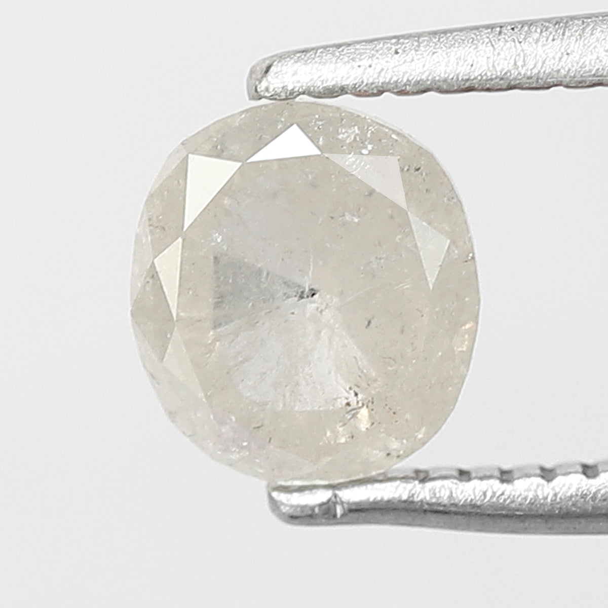 0.76 CT Oval shape Misty White color Natural loose 5.80 mm salt and pepper diamond