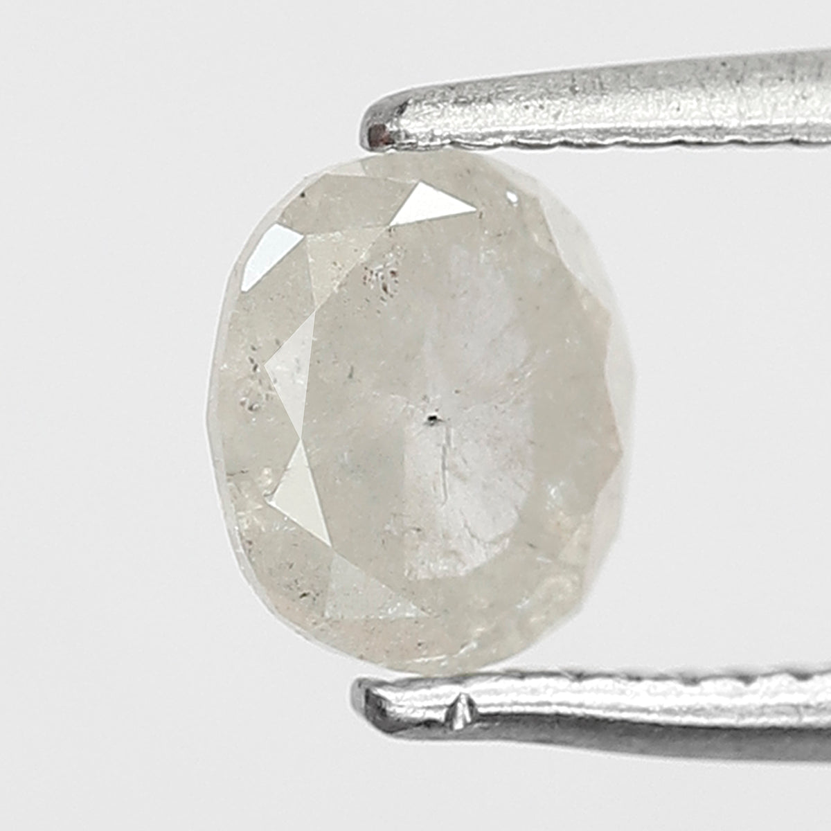 0.76 CT Oval shape Misty White color Natural loose 5.80 mm salt and pepper diamond