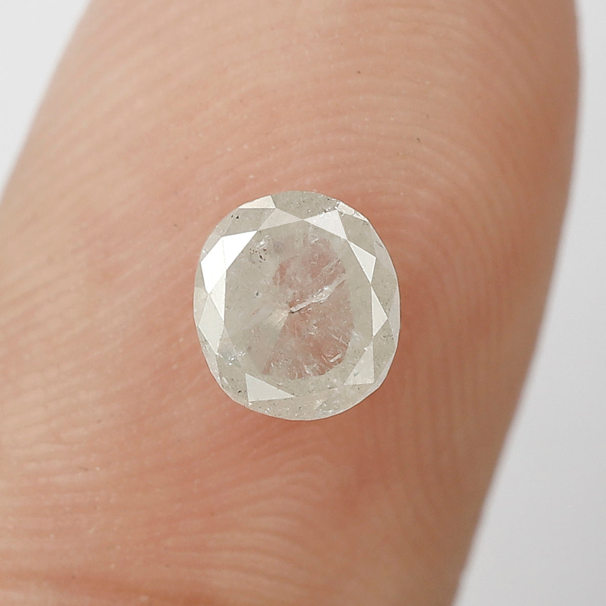 0.76 CT Oval shape Misty White color Natural loose 5.80 mm salt and pepper diamond